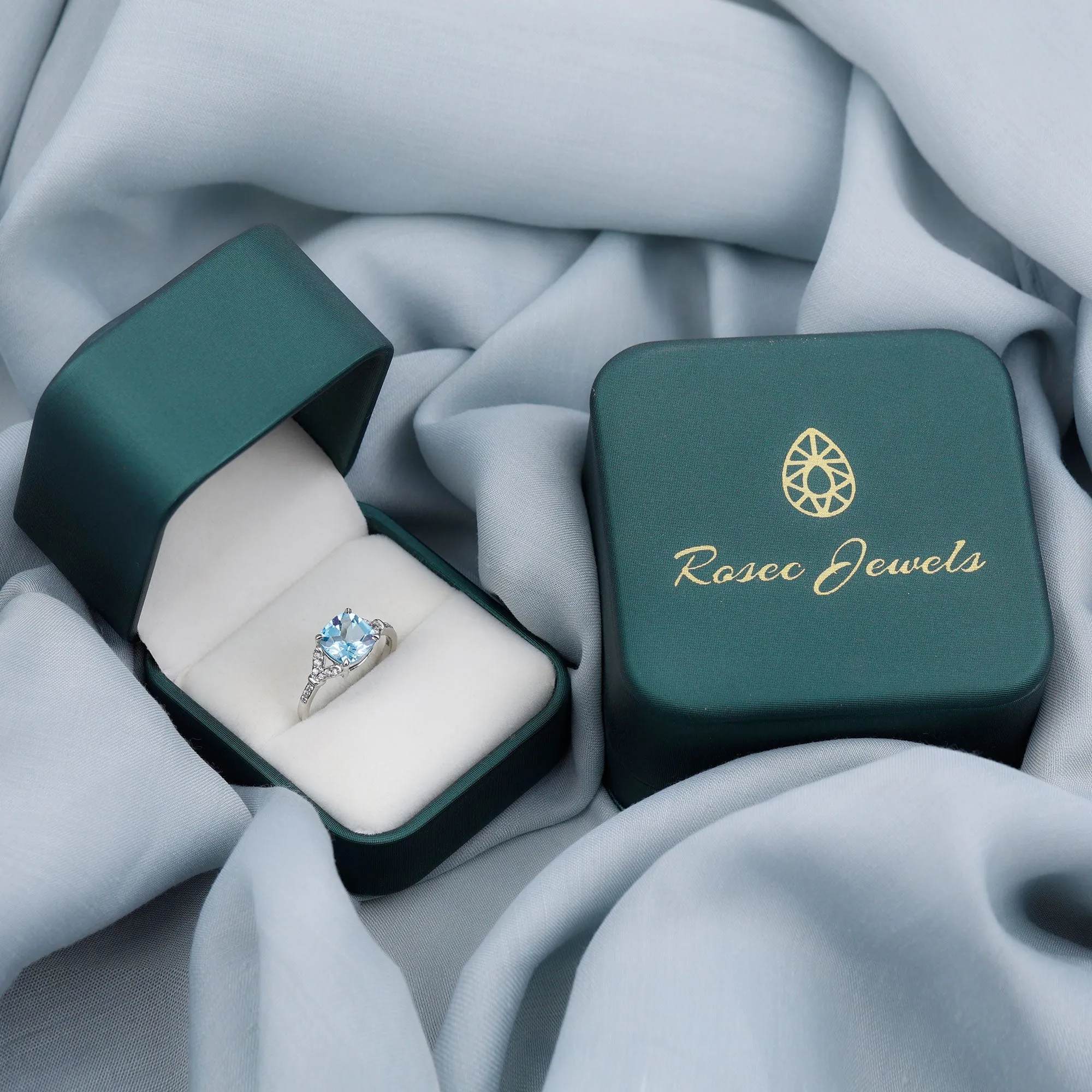 2.75 CT Cushion Cut Swiss Blue Topaz Solitaire with Diamond Side Stone Ring