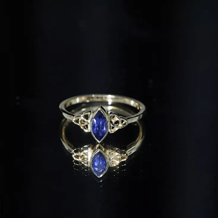 Marquise Cut Created Blue Sapphire Solitaire Celtic Knot Ring in Bezel Setting