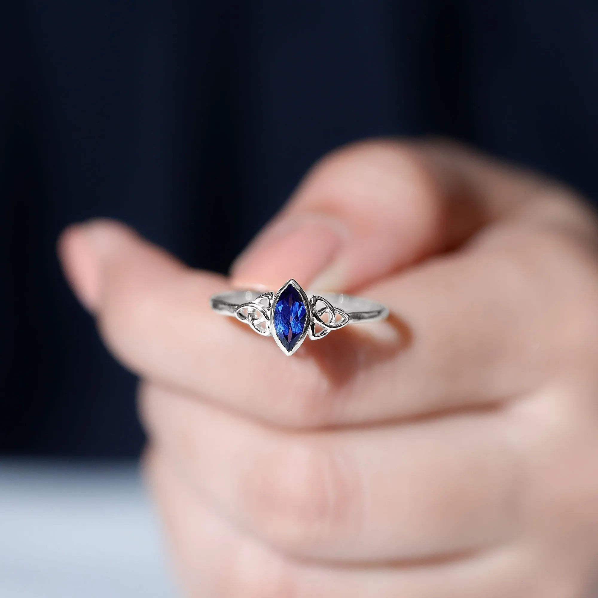 Marquise Cut Created Blue Sapphire Solitaire Celtic Knot Ring in Bezel Setting