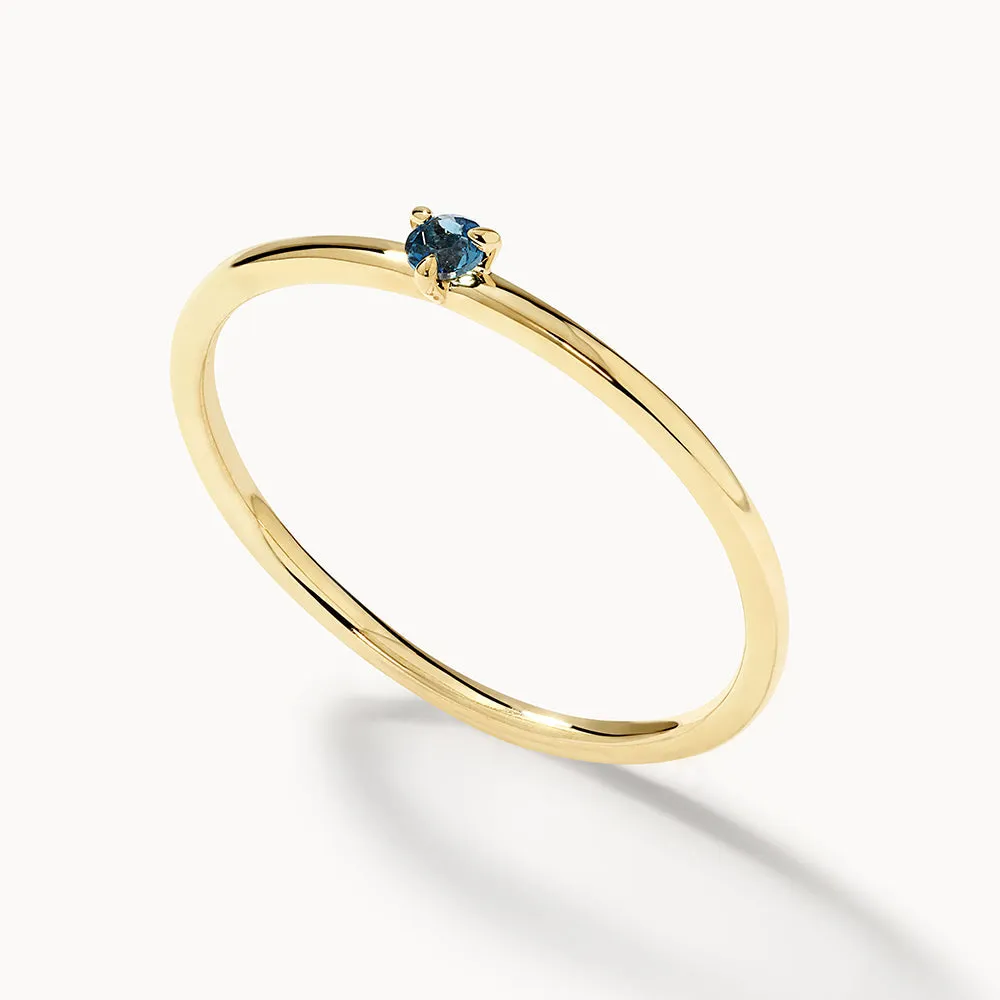 Micro Blue Topaz Round Solitaire Ring in 10k gold