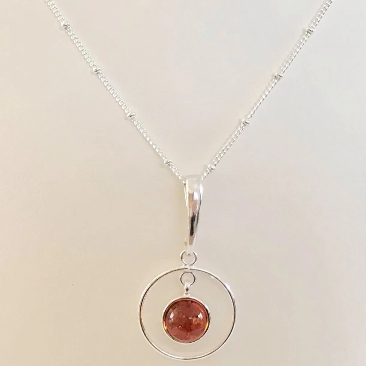Sterling Silver Circular Amber Pendant Necklace