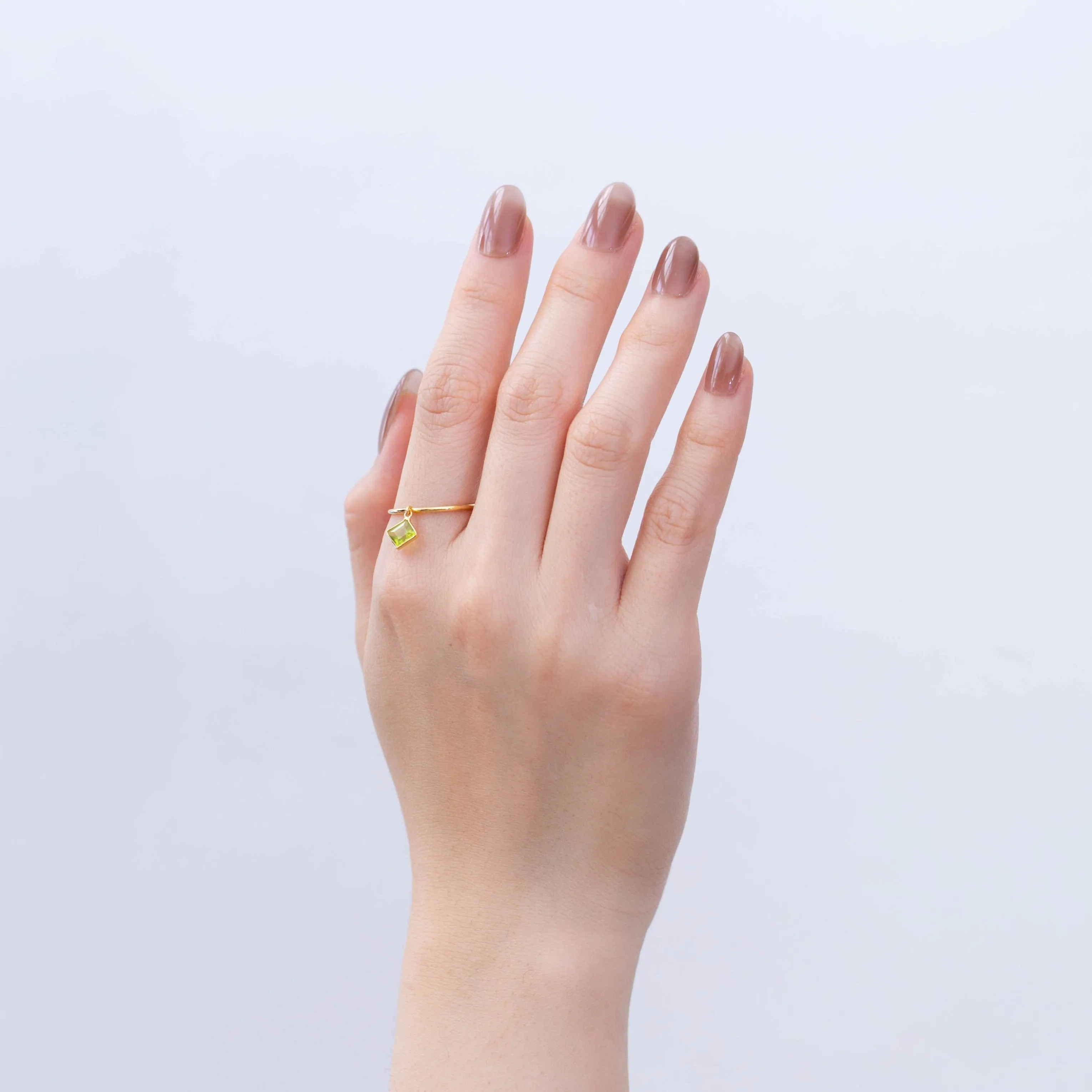 Swinging square peridot ring